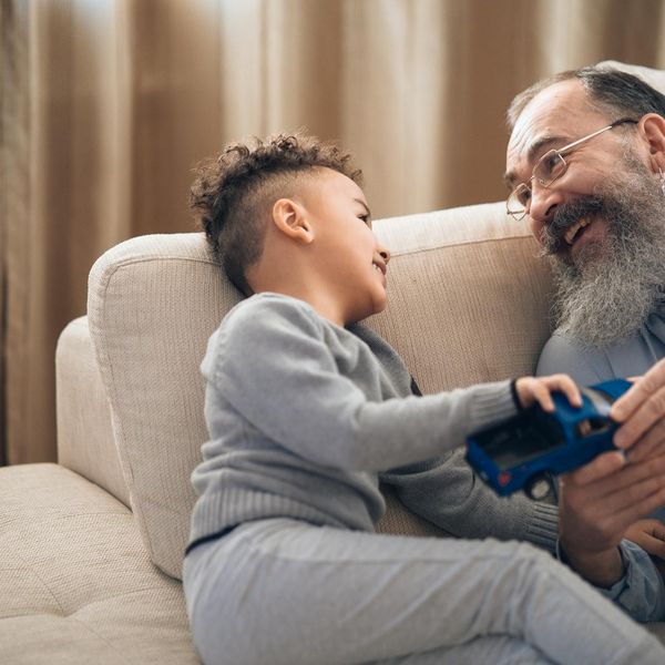 Person stretching on a yoga mat with a serene expression.